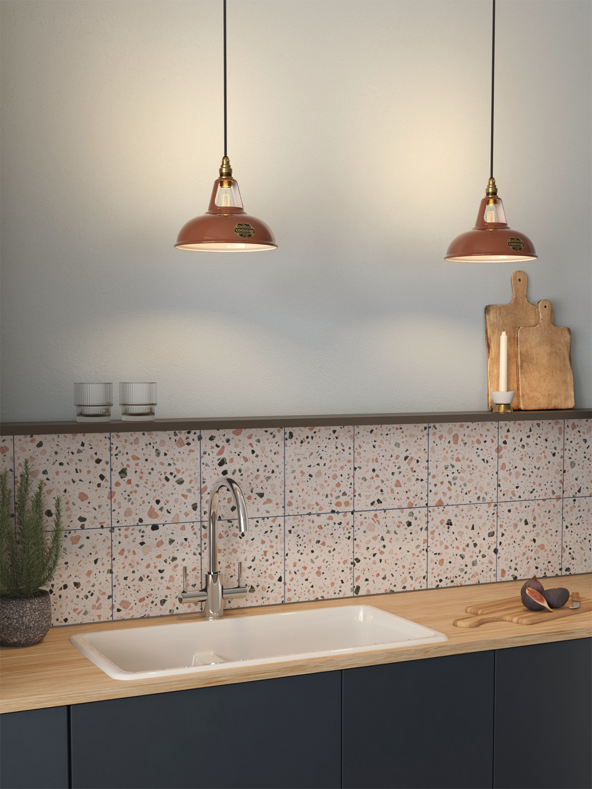Two Original and one Large deep Yellow lampshades hang over a yellow kitchen counter