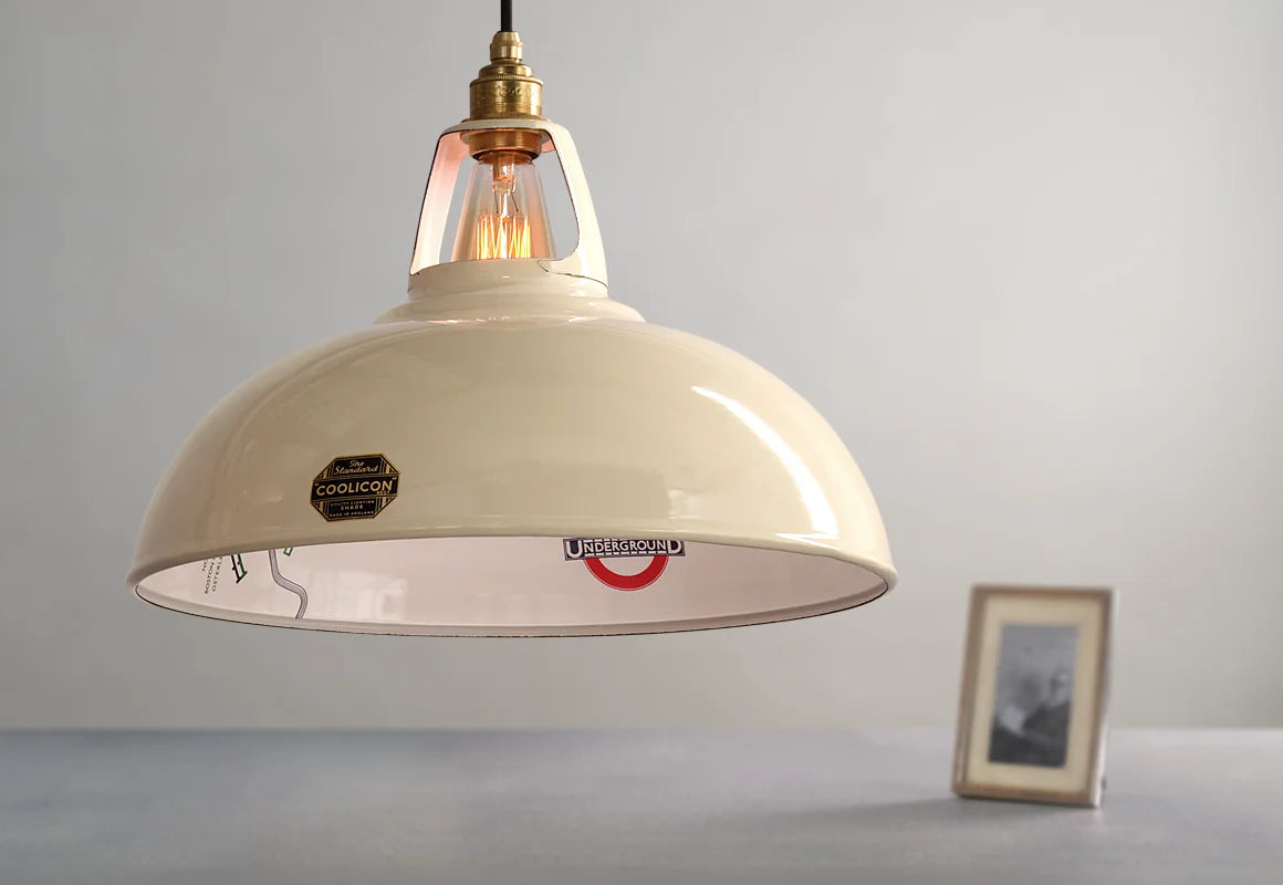 A Large Paper Cream shade over a table and a black and white photo of Harry Beck