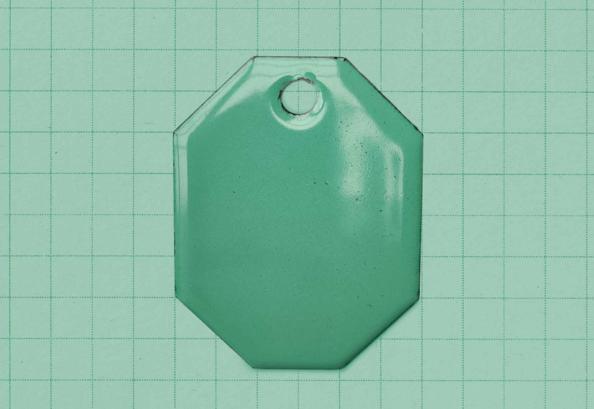 A vitreous enamel colour sample of the colour Fresh Teal from Coolicon Lighting