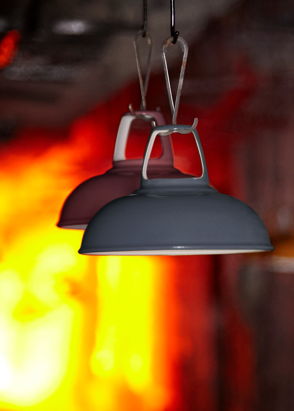 Two Coolicon shades, Selvedge and Metropolitan going inside the furnace. The flames of the furnace can be seen in the background