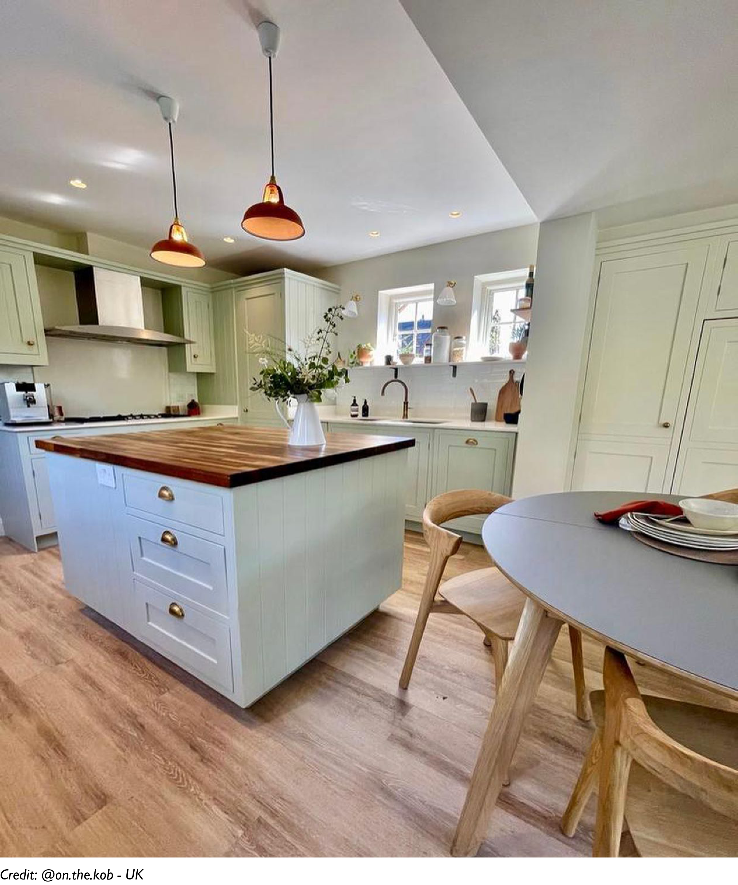 Two Natural Terracotta lampshades hang above a kitchen island
