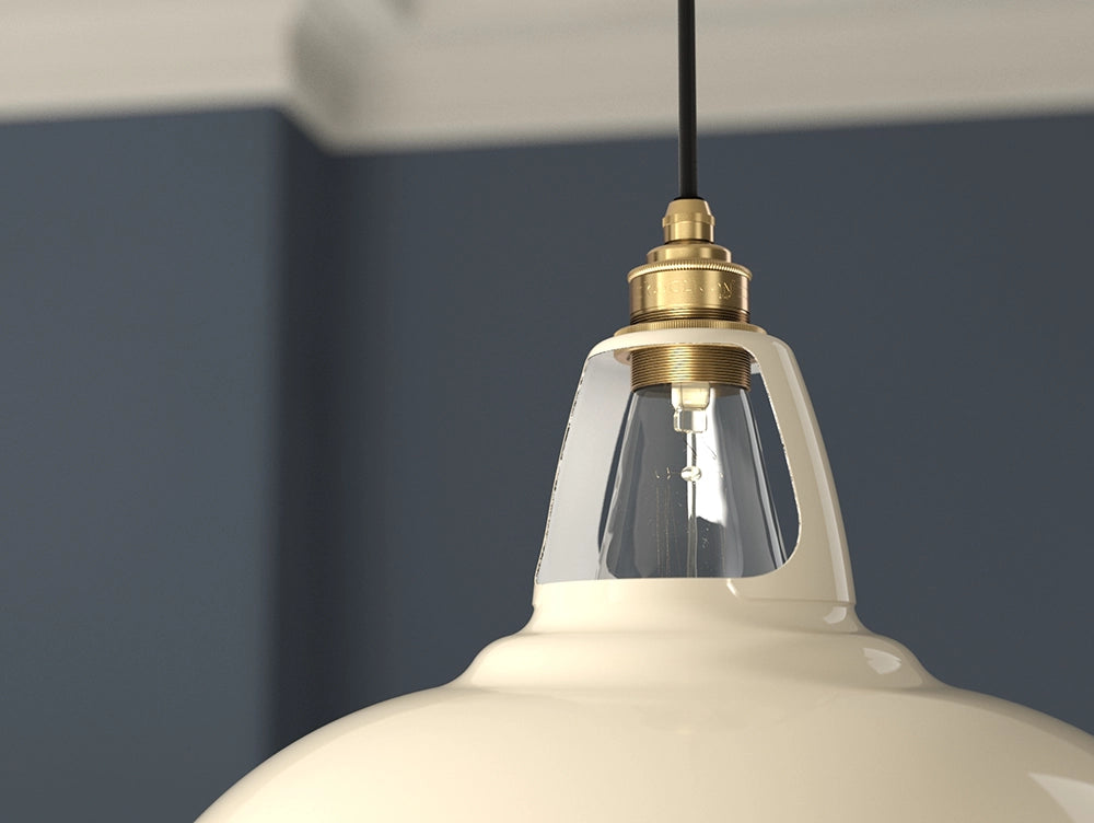 A close up of the E27 brass suspension set being used with a Large Classic Cream Coolicon lampshade
