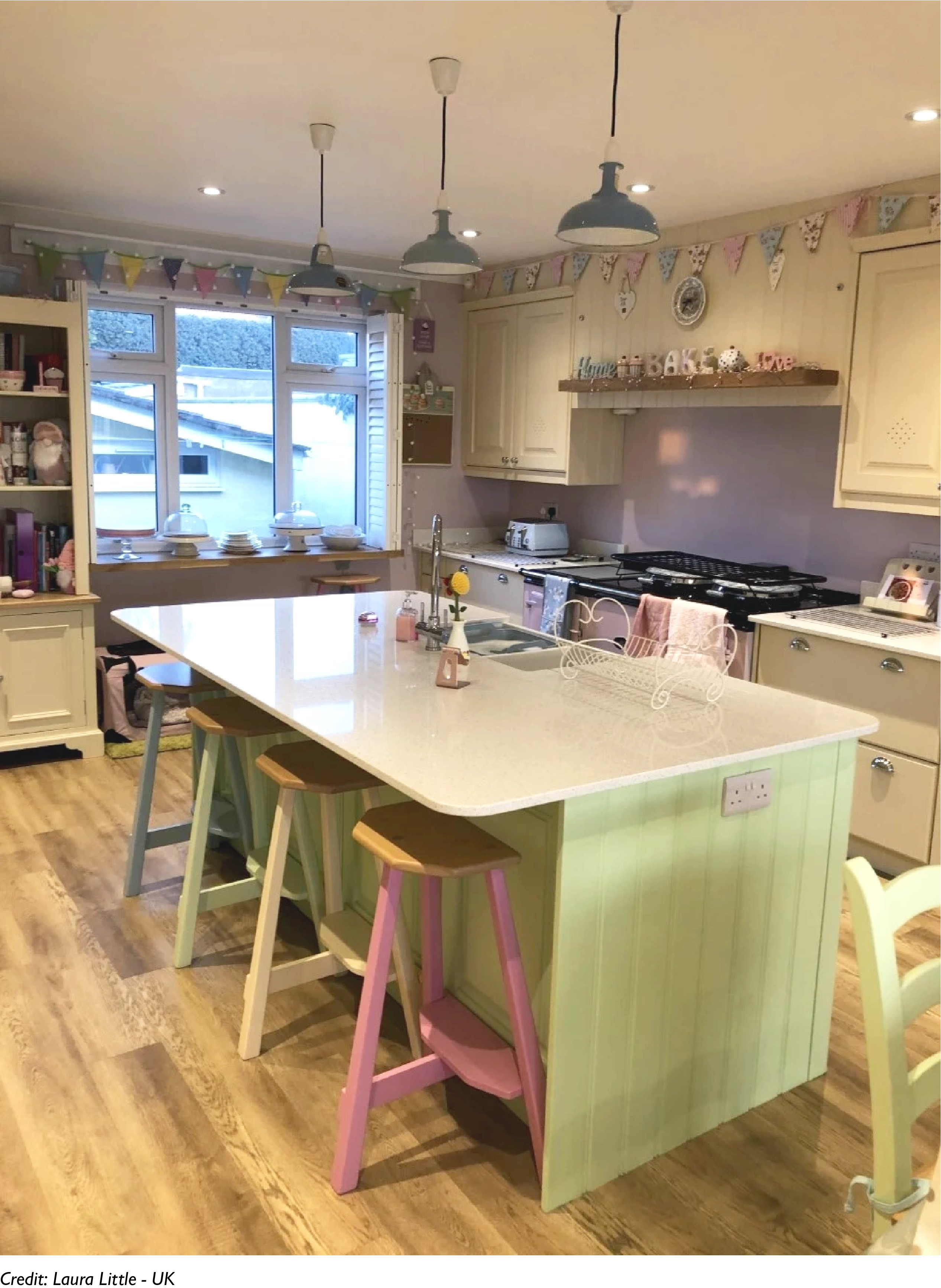 Three Original Coolicon lampshades are hung over a kitchen island in a bright room