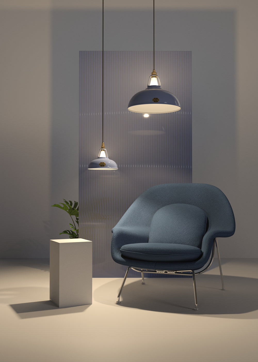 An Original and a Large Sky Blue lampshade hanging over an armchair, in front of a frosted glass panel