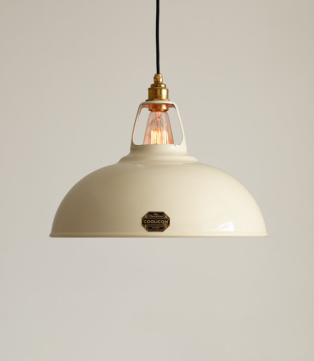 A Large Classic Cream lampshade hanging over a cream background