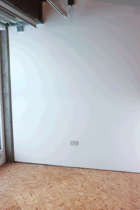 A GIF of a plywood Point of Sale Lighting Display Stand being assembled.