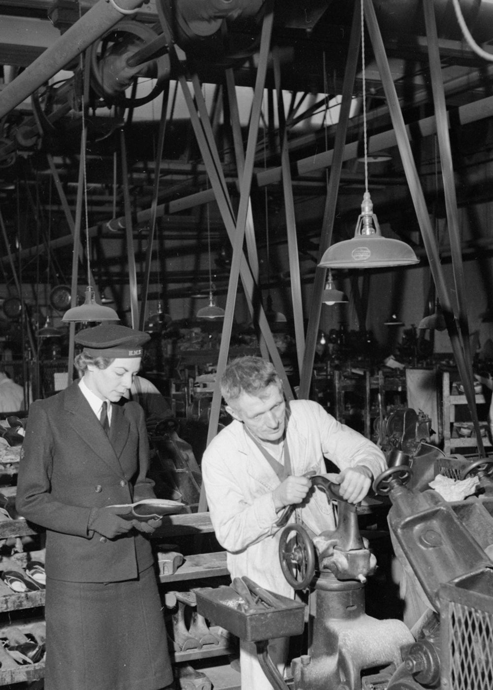 Black and white photo of a shoe factory lit by Coolicon lampshades