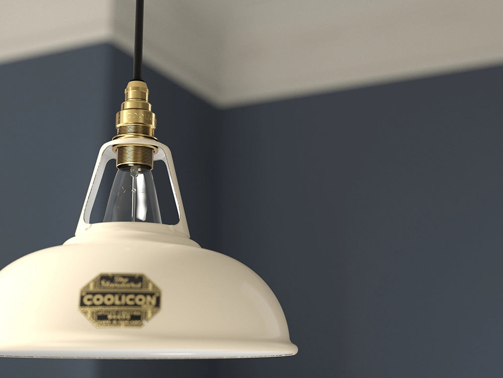 A close up of the E14 brass suspension set being used with an Original Classic Cream Coolicon lampshade