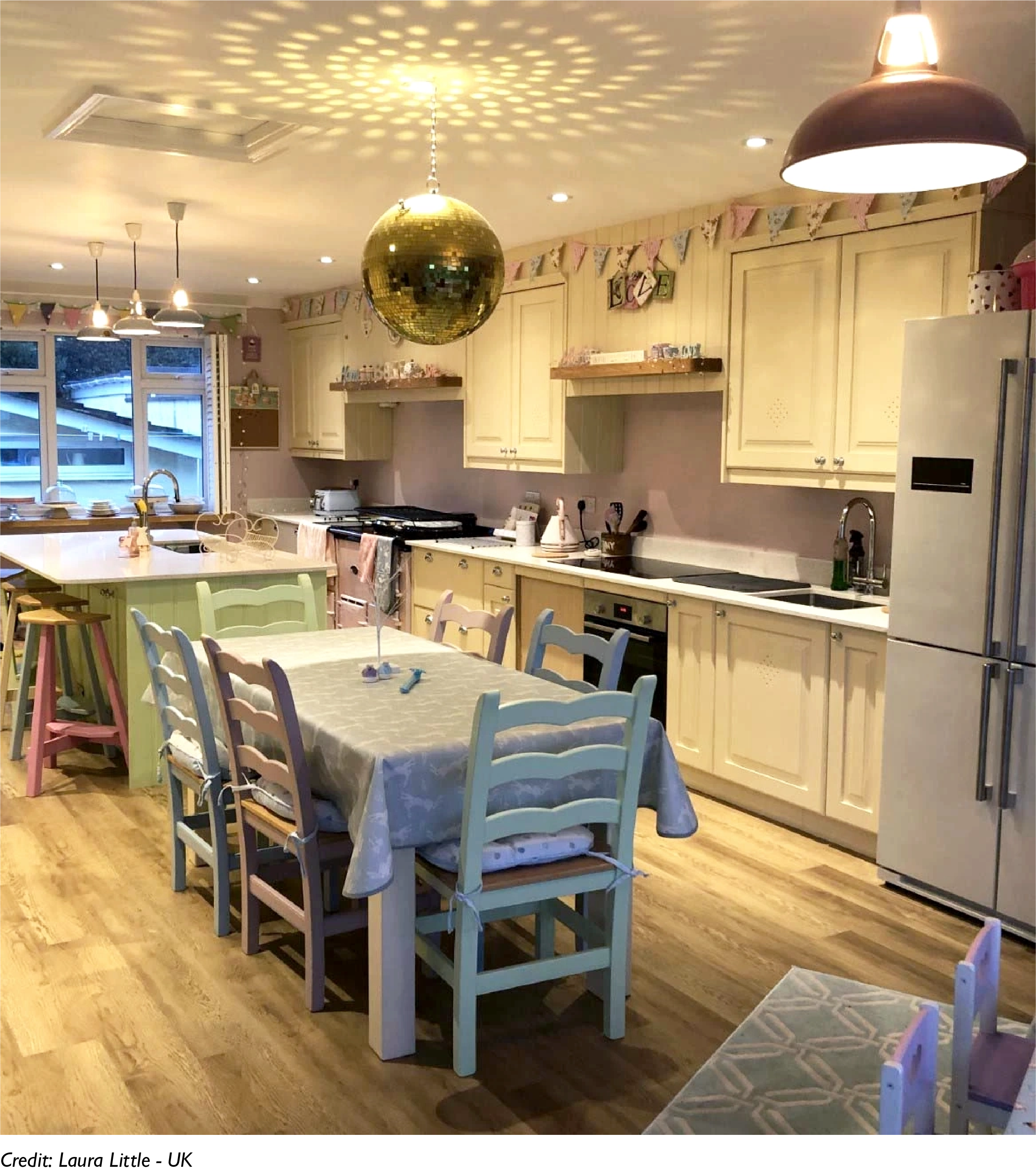 A Large Terracotta lampshade hangs in a kitchen, providing ambient light