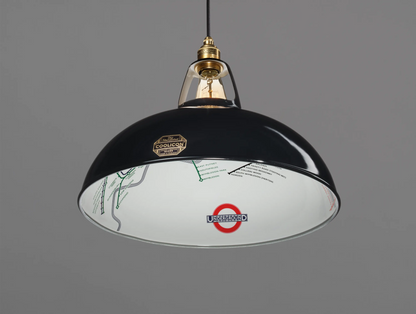 A Large Northern Line Black shade hanging over a grey background