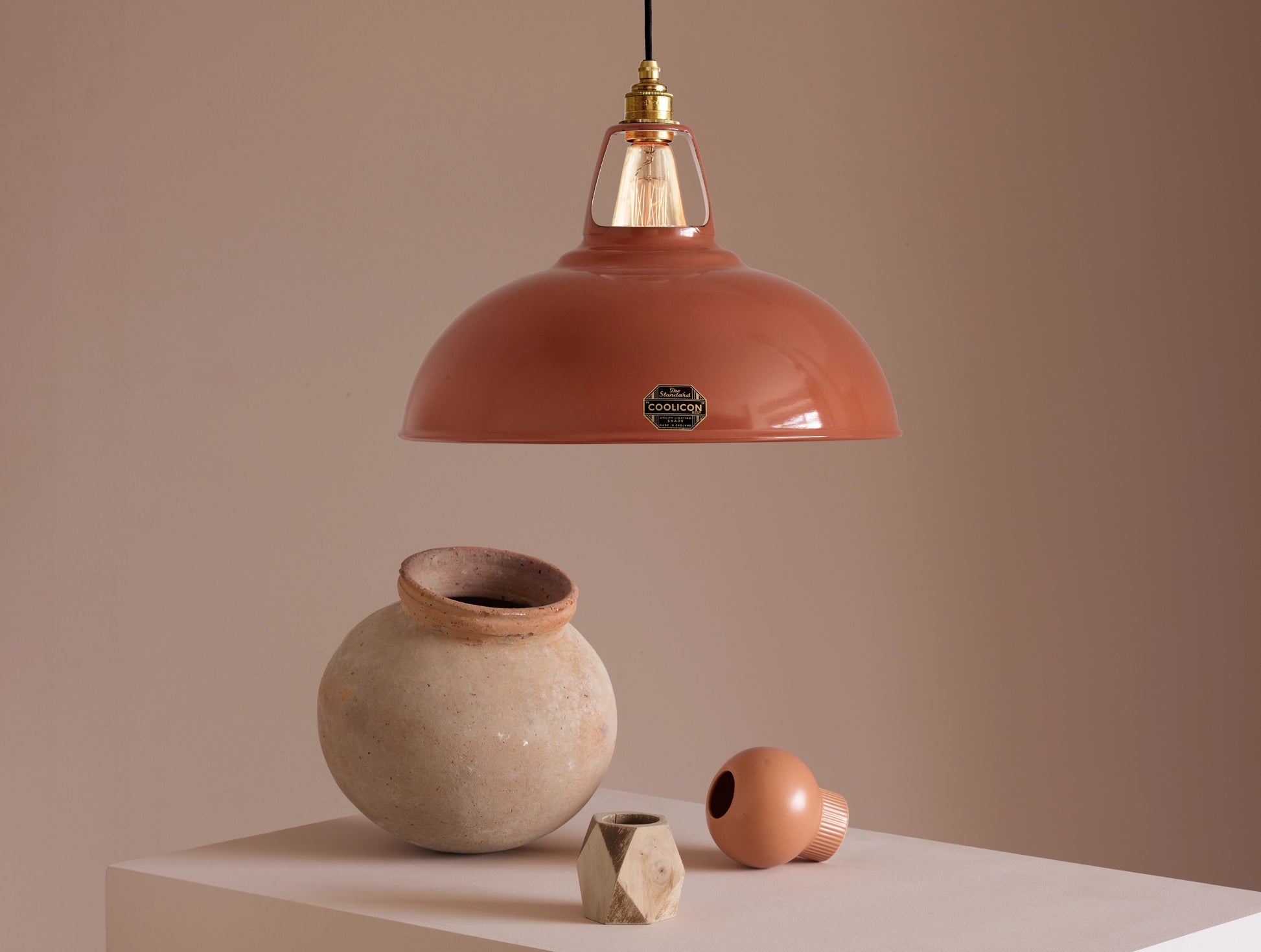 Large Terracotta Coolicon lampshade with a Porcelain pendant set over a light teal background